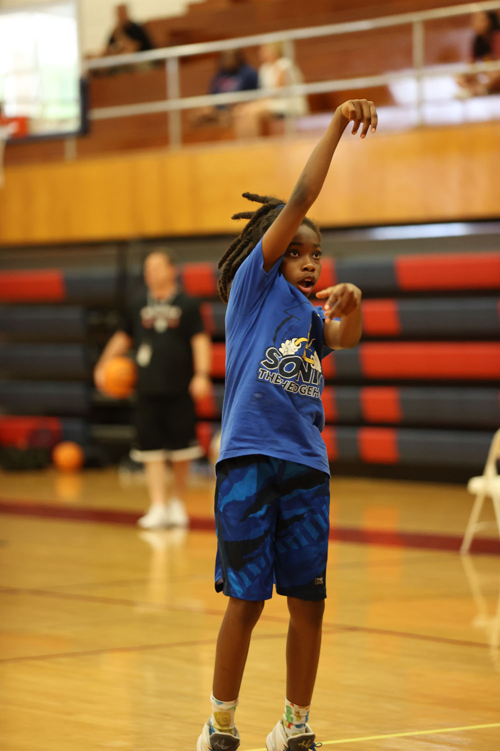 Camper looking for the ball to go in the basket