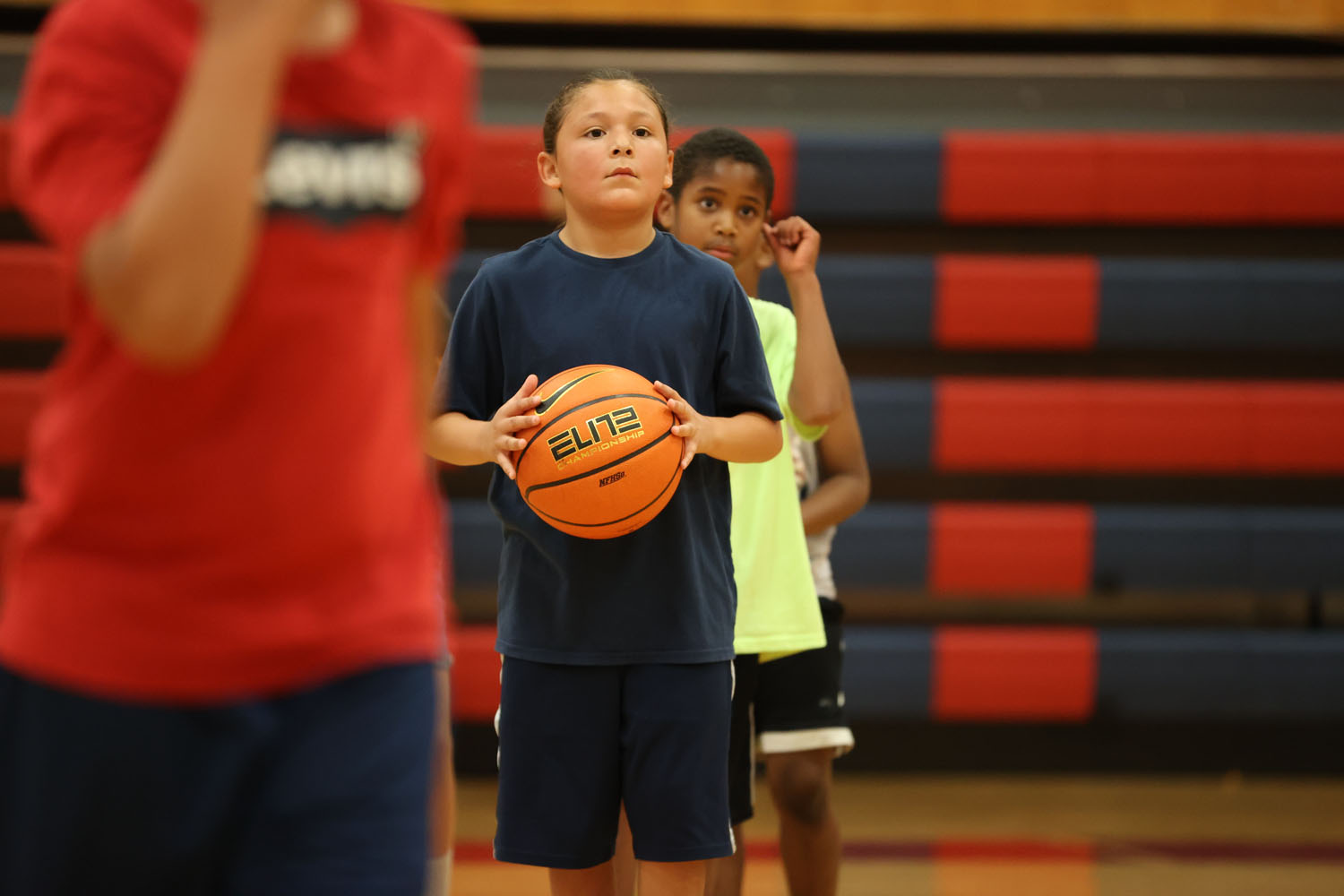 Camper waiting his turn to pass the ball